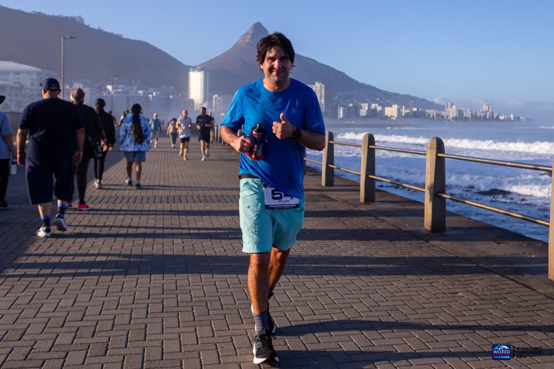 Running the Cape Town marathon along the sea wall with Lion's Head behind